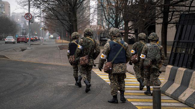 Kazakh soldiers patrol a street in the country’s biggest city, Almaty, after violence erupted following protests last week. Picture: AFP