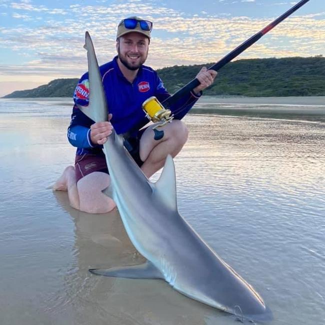 Mr Parkinson has reeled in an increasing number of sharks while fishing on the shores of Fraser Island.