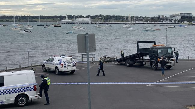 A dinghy is towed at the scene of a drowning on Wednesday morning near Griffin Gully Pier off The Esplanade at Western Beach. Picture: Laura Placella