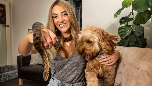 Veronica Gregory is able to have her pet snake under Victoria's rental laws. Picture: Tony Gough