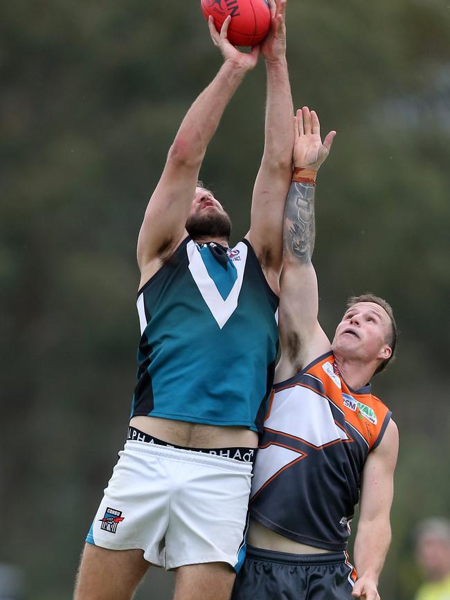 CDHBU’s Jai Green leaps over RWWW Giants player Callum Butler. Picture: Yuri Kouzmin