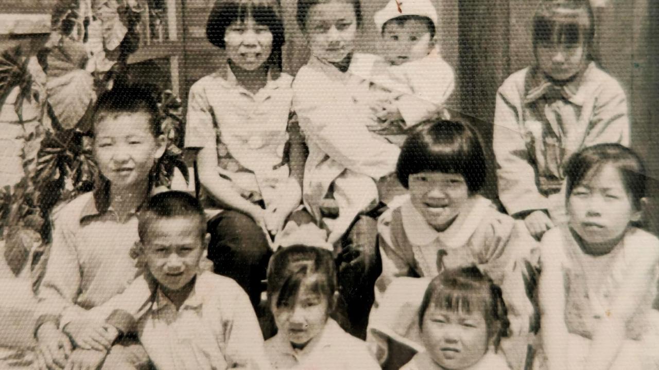 Bruce with other kids in rural China. Picture: Supplied