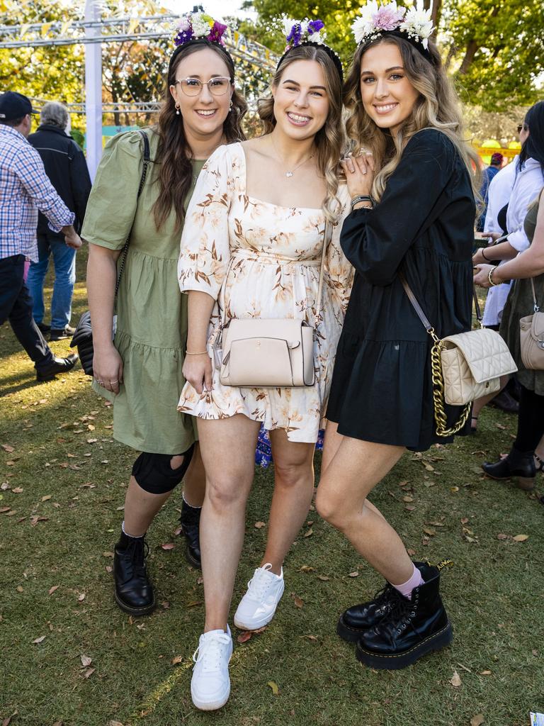 At the Festival of Food and Wine are (from left) Kirsty Tait, Eloise Foley and Shelby Small, Carnival of Flowers 2022, Saturday, September 10, 2022. Picture: Kevin Farmer