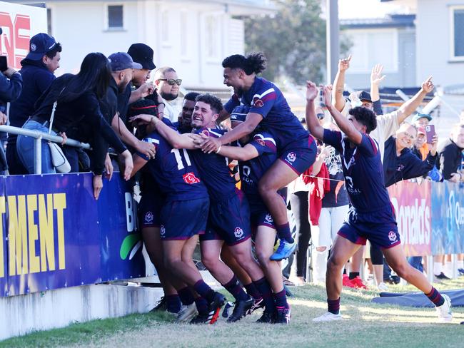 Ipswich SHS player Josiah Pahulu celebrates with teammates after a try. Picture: NIGEL HALLETT