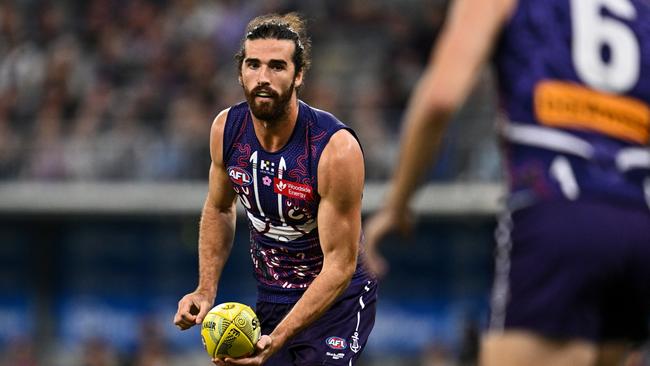 PERTH, AUSTRALIA - MAY 24: Alex Pearce of the Dockers handpasses the ball during the 2024 AFL Round 11 match between Walyalup (Fremantle) and the Collingwood Magpies at Optus Stadium on May 24, 2024 in Perth, Australia. (Photo by Daniel Carson/AFL Photos via Getty Images)