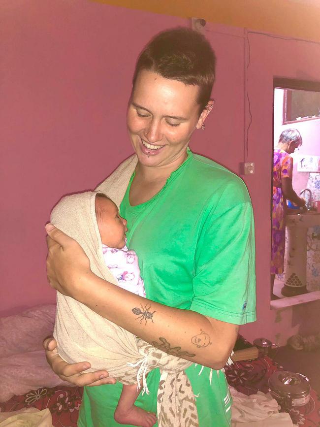 A Brisbane family have been left in limbo after 22-year-old backpacker India Hodgkins (pictured with baby boy Neo) discovered she was pregnant two days before going into labour in a rural town in Nepal. Picture: Supplied.