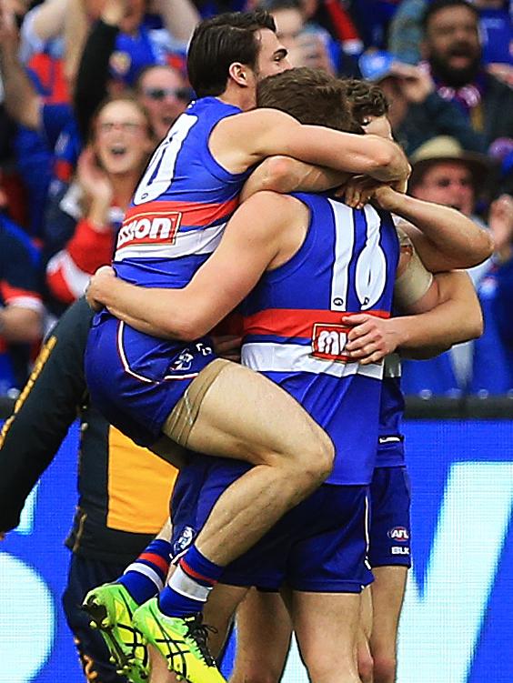 Bulldogs players celebrate their Grand Final win. Picture: Toby Zerna