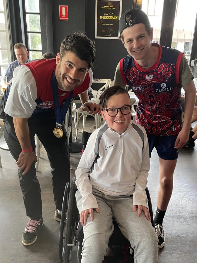 Lucas Peters and his cousin Oli spending time with Christian Petracca on Sunday after the AFL grand final celebrations.