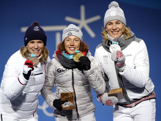 Bronze medalist Anais Bescond of France, gold medalist Laura Dahlmeier of Germany and silver medalist Anastasiya Kuzmina of Slovakia pose during the medal ceremony after the Women’s Biathlon 10km Pursuit pose on day four of the PyeongChang 2018 Winter Olympic Games at Medal Plaza on February 13, 2018 in Pyeongchang-gun, South Korea. Picture: Getty Images