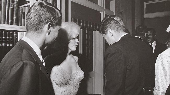  Marilyn Monroe with President John F. Kennedy, centre, and Robert Kennedy, left, at a Democratic fundraiser on May 19, 1962.