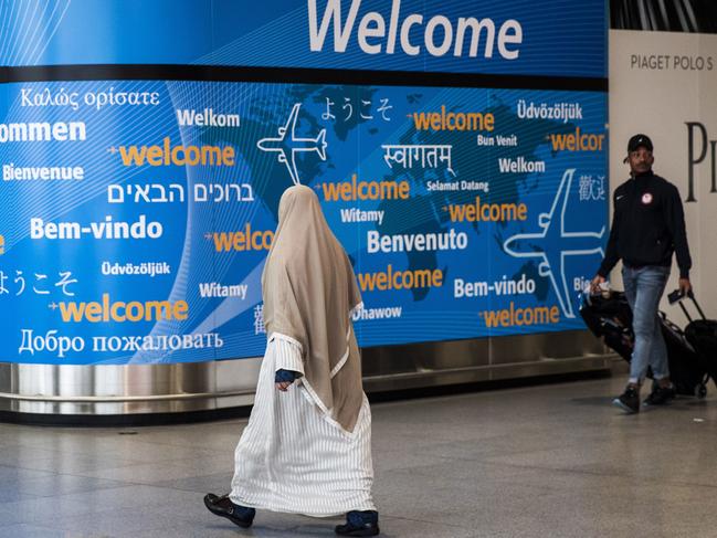 NEW YORK, NY - MARCH 6: Travelers arrive at the international terminal at John F. Kennedy International Airport, March 6, 2017 in New York City. President Donald Trump signed a new executive order on Monday that will ban travelers from six majority-Muslim nations from entering the United States for 90 days. Drew Angerer/Getty Images/AFP == FOR NEWSPAPERS, INTERNET, TELCOS & TELEVISION USE ONLY ==