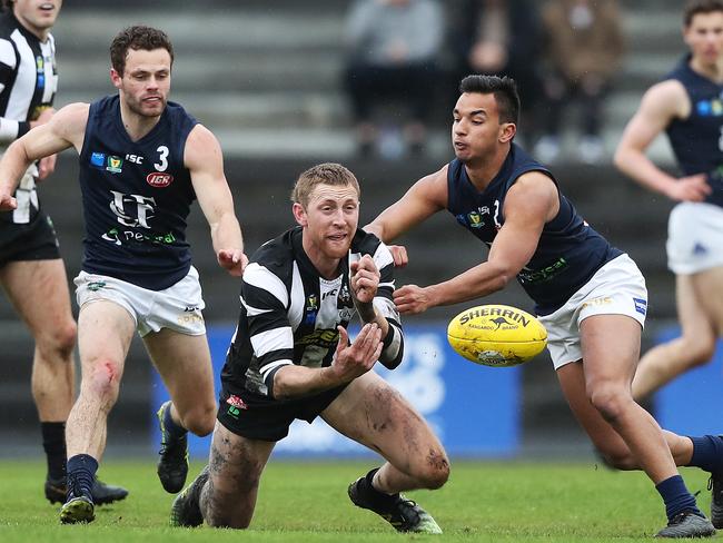 Football. Tasmanian State League. Glenorchy V Launceston. L-R Jay Blackberry Launceston, John Geard Glenorchy, Grant Holt Launceston. Picture: NIKKI DAVIS-JONES