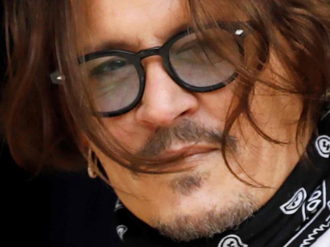 US actor Johnny Depp arrives on the fifth day of his libel trial against News Group Newspapers (NGN), at the High Court in London, on July 13, 2020. - Depp is suing the publishers of The Sun and the author of the article for the claims that called him a "wife-beater" in April 2018. (Photo by Tolga AKMEN / AFP)