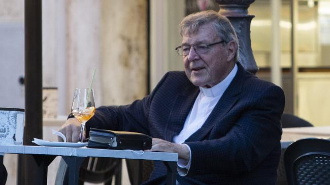 Cardinal George Pell enjoys an aperitif at the bar outside the Vatican in Rome. Picture: Stefano Costantino / Mega