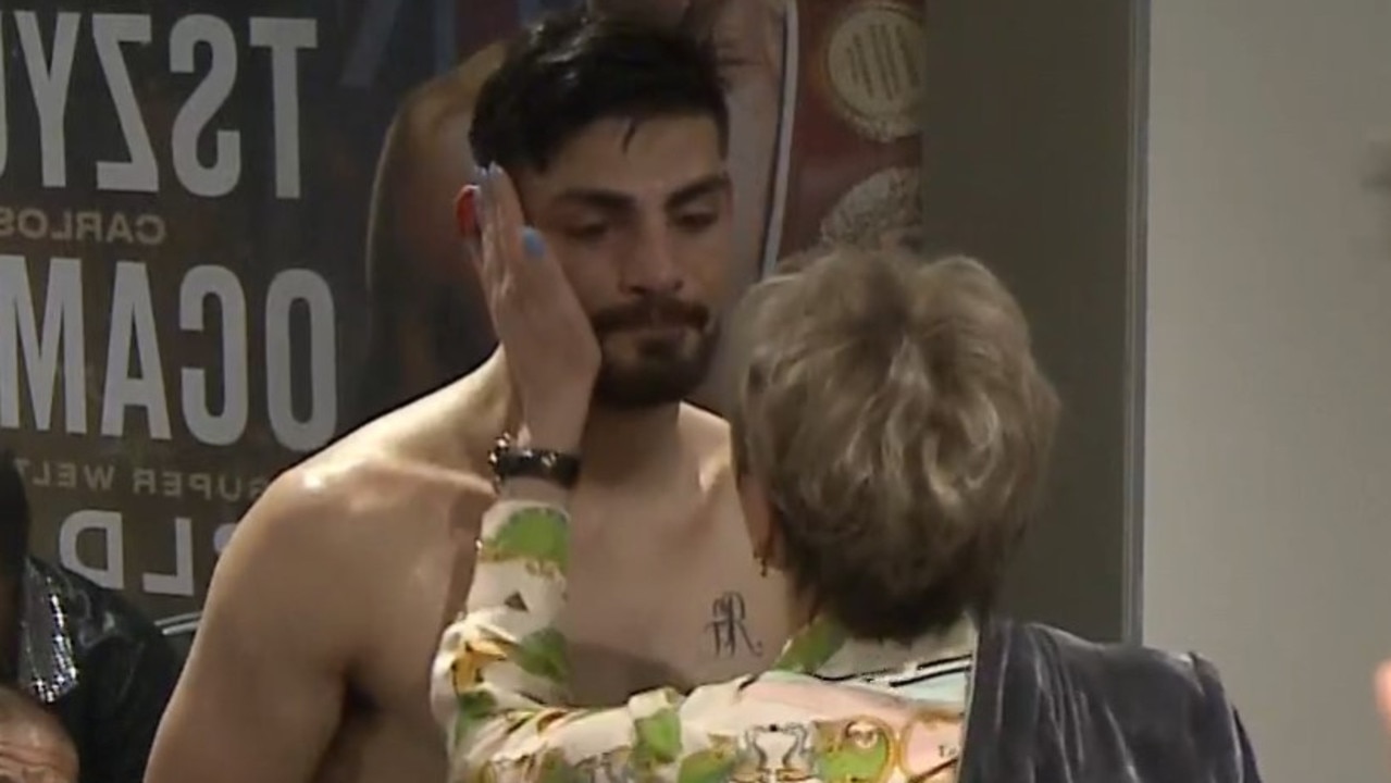 Natalia Tszyu consoles Carlos Ocampo in his changerooms.