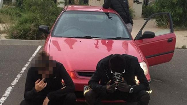 Youths pose in front of a car outside Ecoville Community Park in Tarneit.