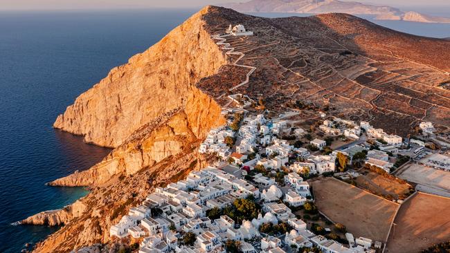 The capital of Hora on Folegandros is built on a cliff above the sea. Picture: Getty.