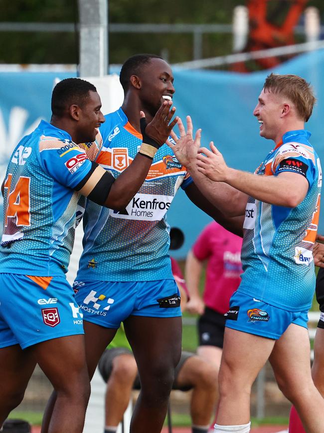 Pride's Dantoray Lui, Marly Bitungane and Will Partridge celebrate a try in the Hostplus Cup Queensland Rugby League (QRL). Picture: Brendan Radke