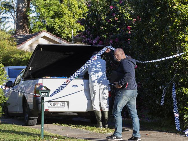 Cleaners at the scene today. Picture: Jenny Evans