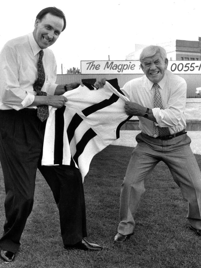 1990. Treasurer Paul Keating and Lou Richards in a non-political tug of war over a Collingwood jumper. Football. Celebrities.