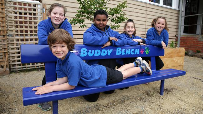 Ascot Vale West Primary School students Roy, Audrey, Houd, Julia and Olivia are enjoying the new buddy bench. Picture: George Salpigtidis