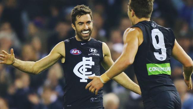 MELBOURNE, AUSTRALIA — JUNE 04: Patrick Cripps of the Blues (R) celebrates a goal with Kade Simpson during the round 11 AFL match between the Carlton Blues and the Brisbane Lions at Etihad Stadium on June 4, 2016 in Melbourne, Australia. (Photo by Michael Dodge/Getty Images)