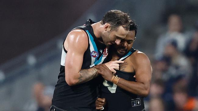 Jeremy Finlayson of the Power speaks with teammate Willie Rioli . (Photo by Michael Willson/AFL Photos via Getty Images)