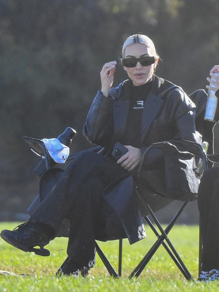 West’s ex-wife, Kim Kardashian, sat nearby in a lawn chair. Photo credit: @CelebCandidly/ Snorlax / MEGA