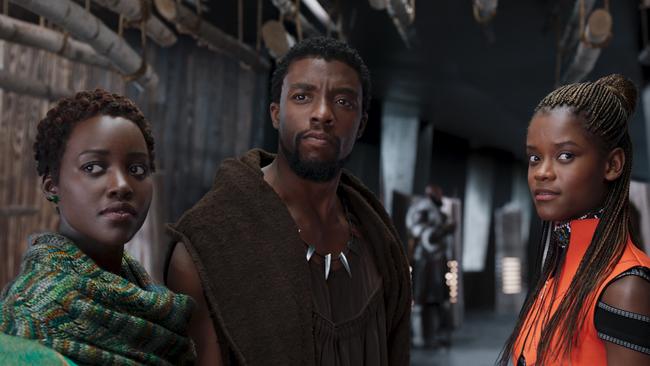 The late Chadwick Boseman as T’Challa in Marvel’s Black Panther, with co-stars Lupita Nyong’o as Nakia (left) and Letitia Wright as Shuri.