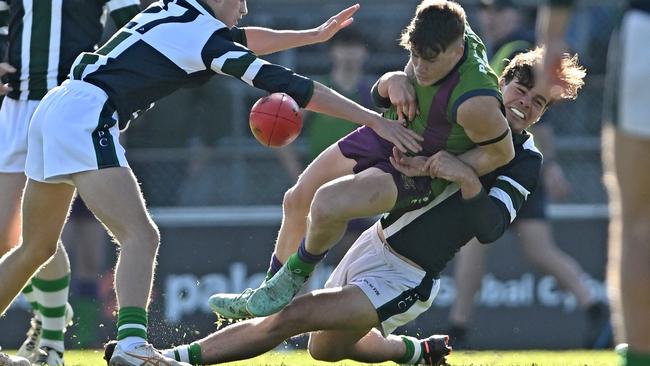 The battle for the ball was fierce between Parade College and St Patrick’s College. Picture: Andy Brownbill