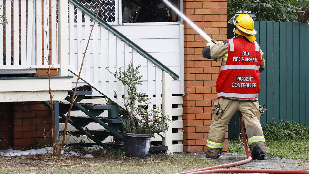 Fire crews attend at a house fire at a house on Thompson street in Deception Bay. Picture: Tertius Pickard