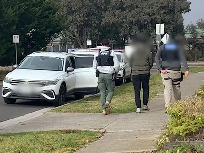 Detectives arrest a man at a property in Sydenham. Picture: Victoria Police