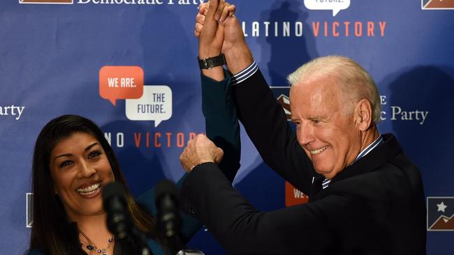 Lucy Flores and Joe Biden at the rally. She claims he kissed the back of her head before they went on stage. Picture: Getty Images.