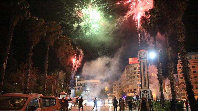 Syrians celebrate in the main square of Homs. Picture: AFP