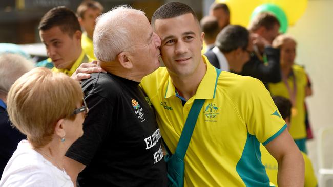 Terry Nickolas with his grandfather Eleftherios Falidis after returning home from the 2018 Commonwealth Games. Picture: Naomi Jellicoe