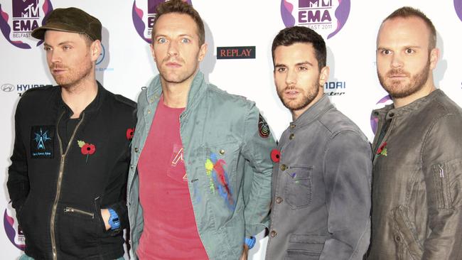 L-R: Jonny Buckland, Chris Martin, Guy Berryman, Will Champion. Melbourne was Coldplay’s first-ever gig without all four members present. Picture: AP