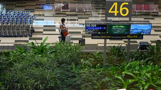 A passenger on the first flight to arrive in Singapore under the new Vaccinated Travel Lane. Picture: AFP