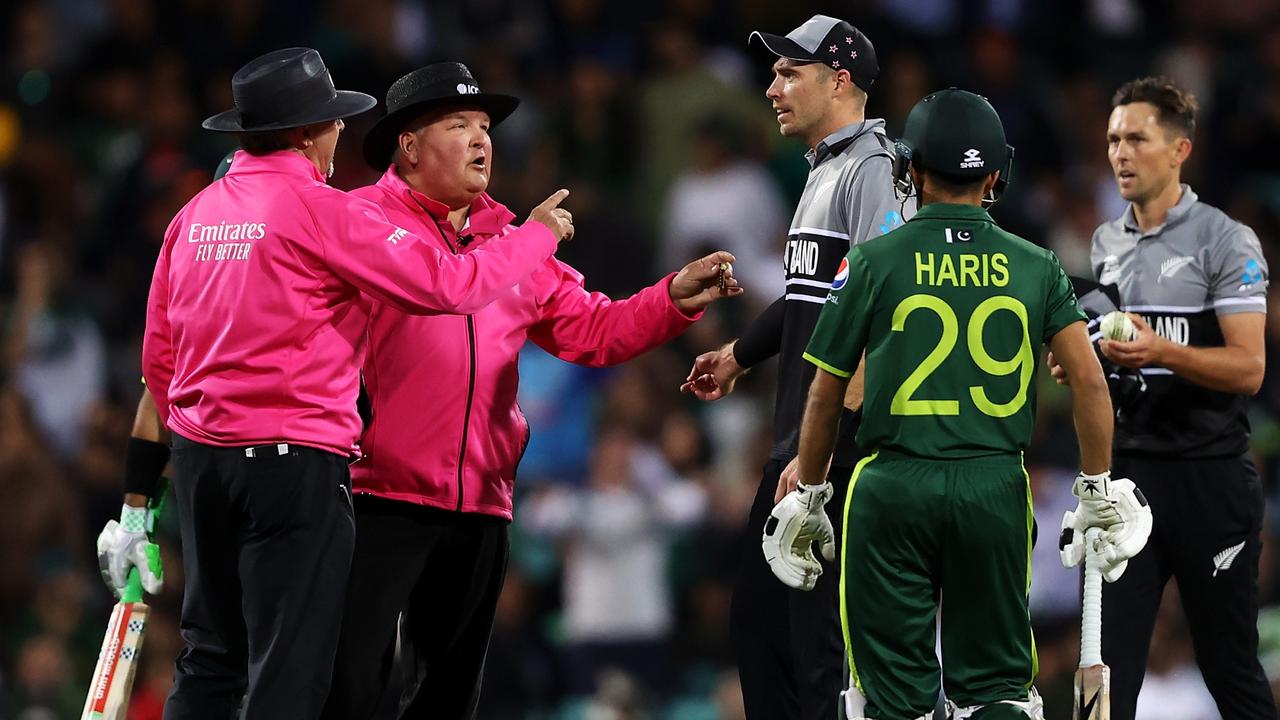 Tim Southee of New Zealand speaks to umpires Richard Illingworth and Marais Erasmus to confirm the dismissal of Mohammad Rizwan. Photo by Mark Kolbe/Getty Images