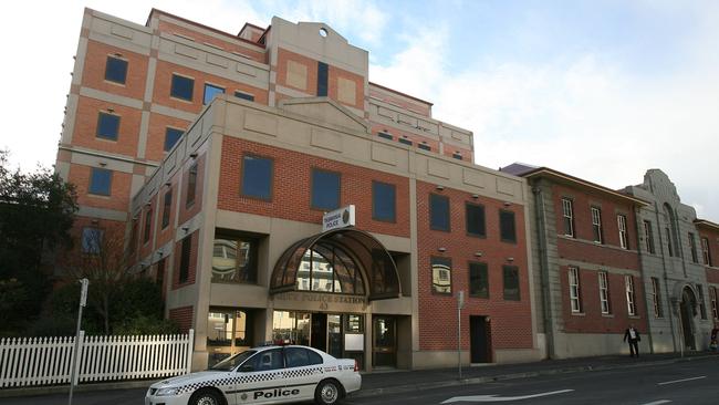 A police officer has pleaded not guilty to assaulting a prisoner while walking him to the Hobart Police Station in November 2017.