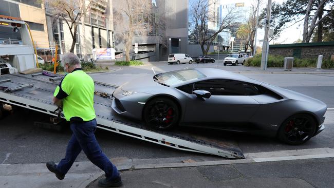 Police tow away a Lamborghini from an inner-Melbourne apartment. Picture: Alex Coppel