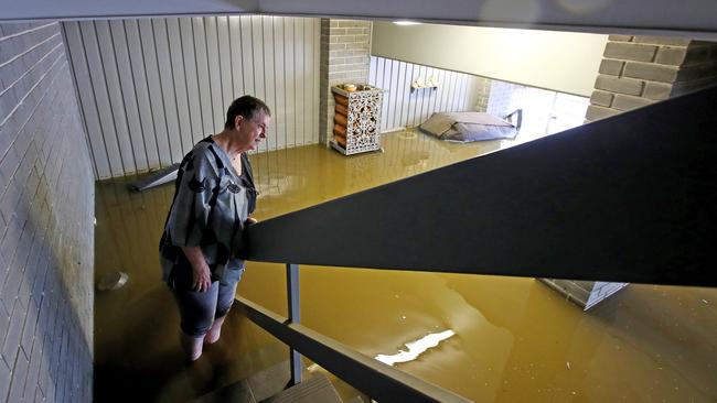 Barbara Mirecki in her flooded home in Regentville, near Penrith in western Sydney, on Sunday. Picture: Toby Zerna