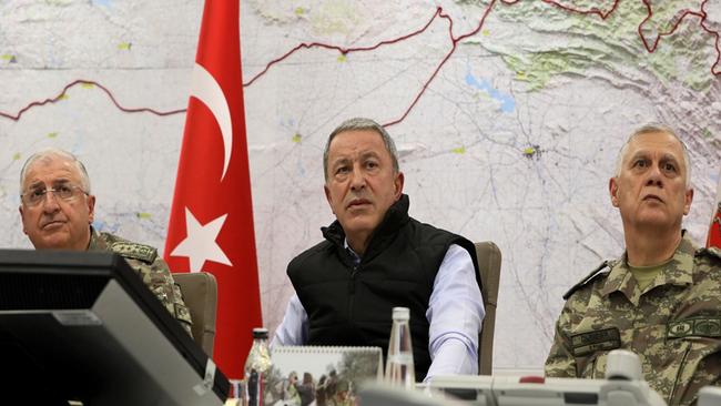 Turkey's Defence Minister Hulusi Akar, (C) with Chief of the General Staff of the Turkish Armed Forces Gen. Yasar Guler, (L), and Gen. Umit Dundar at army headquarters in Ankara. Picture: AP.