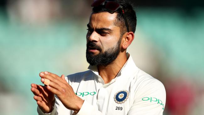 India captain Virat Kohli applauds his team at the end of play on day two at the SCG. Picture: Getty Images