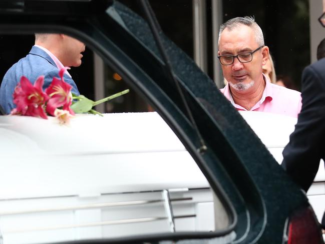 Lloyd Clarke, father of Hannah Clarke, looks on as the coffin is placed in the hearse. Picture: Jono Searle/AAP