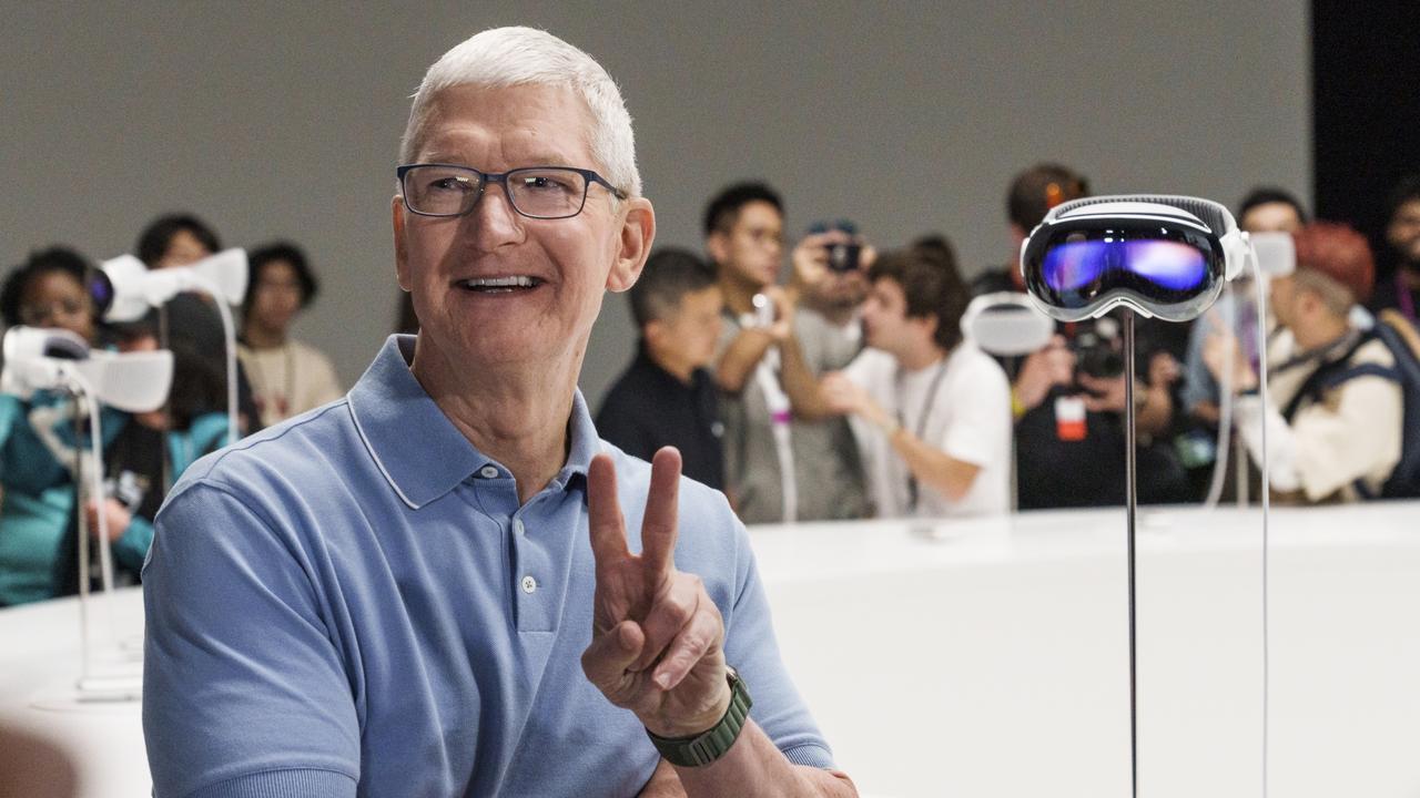 Tim Cook, chief executive officer of Apple Inc, beside an Apple Vision Pro mixed reality (XR) headset unveiled during conference at Apple Park campus. Picture: Philip Pacheco/ Getty Images