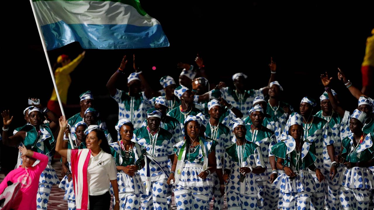 Best outfits go to Sierra Leone. Flagbearer Hafsatu Kamara leads the delegation during the opening ceremony.