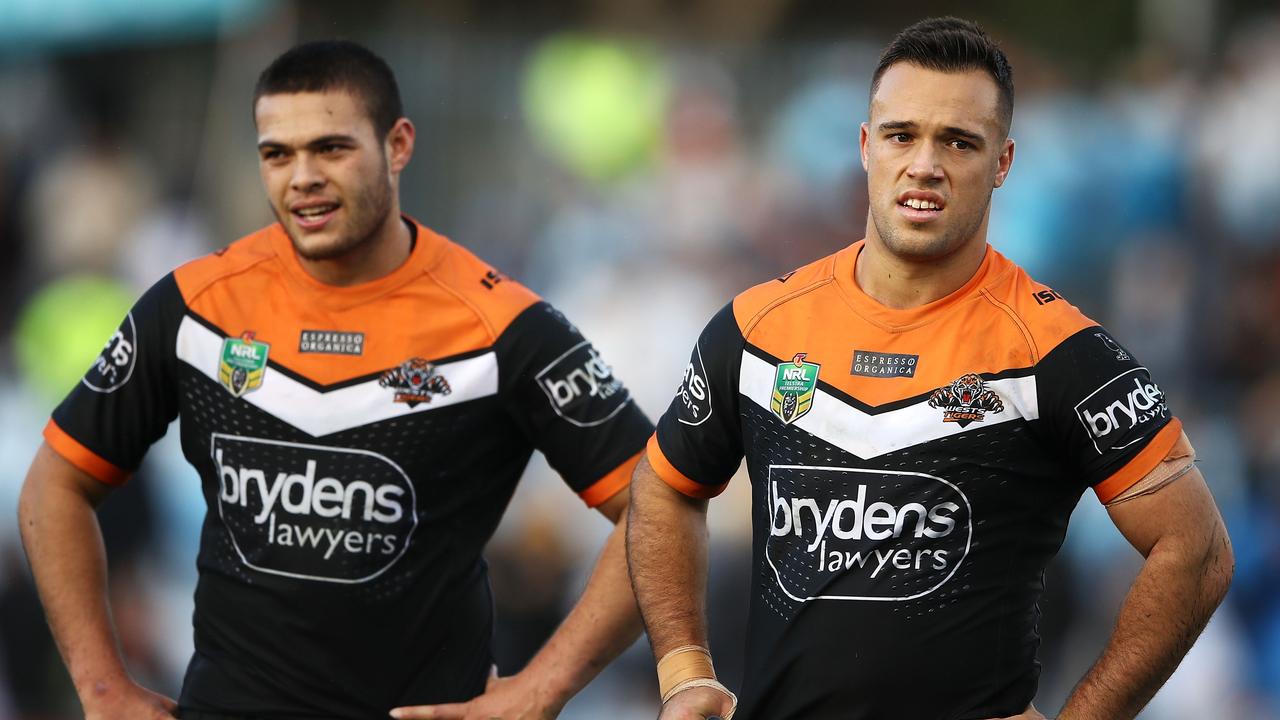 SYDNEY, AUSTRALIA - JUNE 10: Tuimoala Lolohea and Luke Brooks of the Tigers look dejected after defeat during the round 14 NRL match between the Cronulla Sharks and the Wests Tigers at Southern Cross Group Stadium on June 10, 2018 in Sydney, Australia. (Photo by Mark Kolbe/Getty Images)