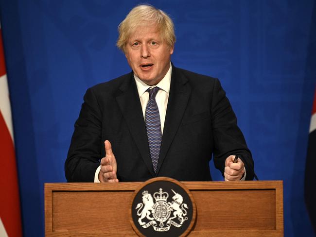 (FILES) In this file photo taken on July 12, 2021 Britain's Prime Minister Boris Johnson gives an update on relaxing restrictions imposed on the country during the coronavirus covid-19 pandemic at a virtual press conference inside the Downing Street Briefing Room in central London on July 12, 2021. - Britain's Prime Minister Boris Johnson and Chancellor of the Exchequer Rishi Sunak have both been designated a close contact of a person infected with Covid, Downing Street said July 18, 2021. The development came just as Johnson's government prepares to ditch most pandemic restrictions in England on July 19. Health Secretary Sajid Javid confirmed on July 17 he had tested positive for Covid-19 and was now self-isolating for 10 days. (Photo by DANIEL LEAL-OLIVAS / POOL / AFP)