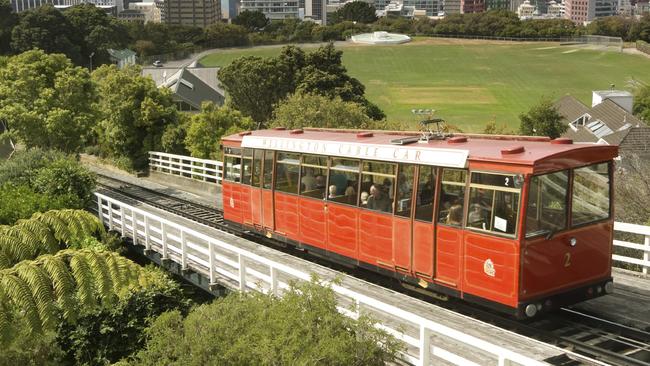 Wellington’s famous cable car with the city in the background.