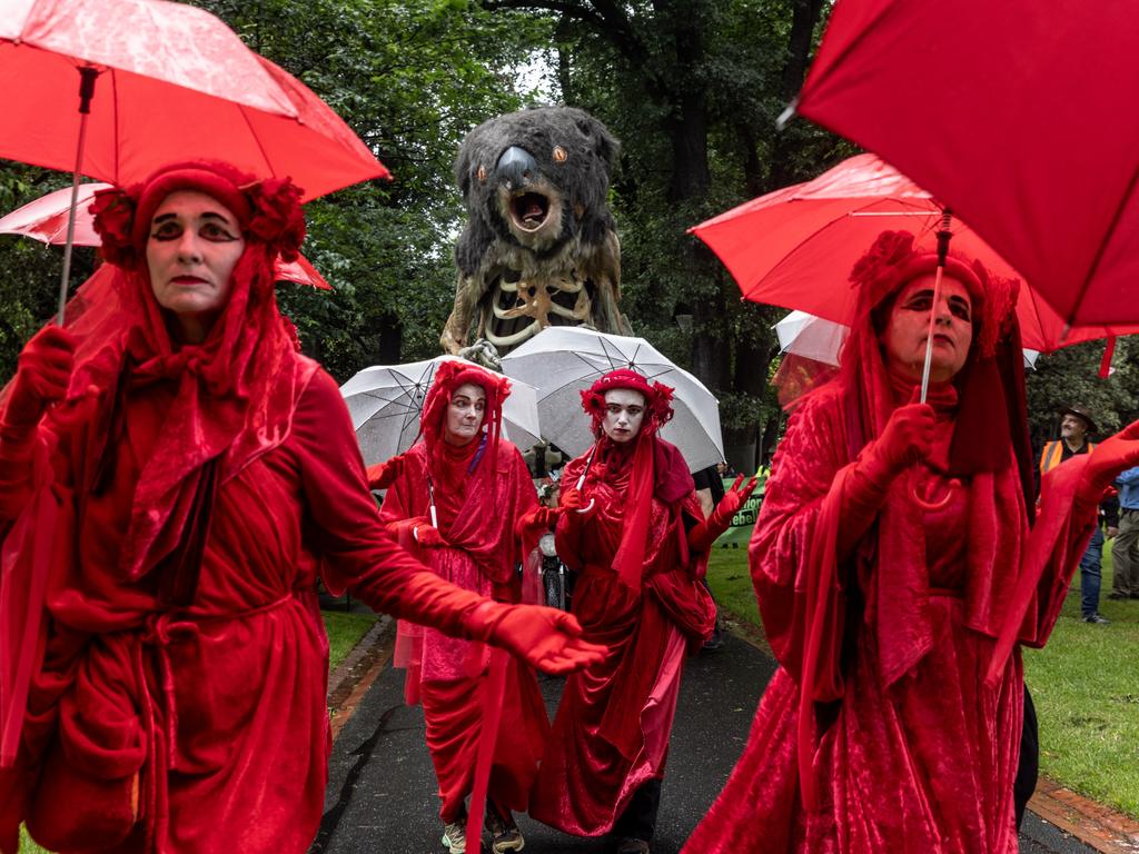 Environmental activists march through Treasury Garden in Melbourne as Australia prepares for a scorching summer. Picture: Diego Fedele/Getty Images
